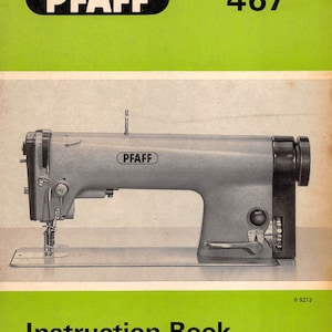 以下が含まれることがあります： Pfaff 467ミシン用の取扱説明書。表紙には、銀色とグレーで、黒いPfaffロゴが付いたミシンの写真が掲載されています。