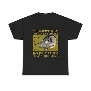 May include: Black t-shirt with a graphic of a rat in a block of cheese. The text "チーズの中で迷った LOST IN THE CHEESE 私を許してください PLEASE FORGIVE ME" is printed in yellow on the shirt.