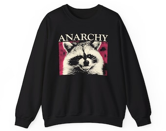 Peut inclure: Sweat-shirt noir avec un graphique d'un raton laveur avec le mot "ANARCHY" au-dessus.