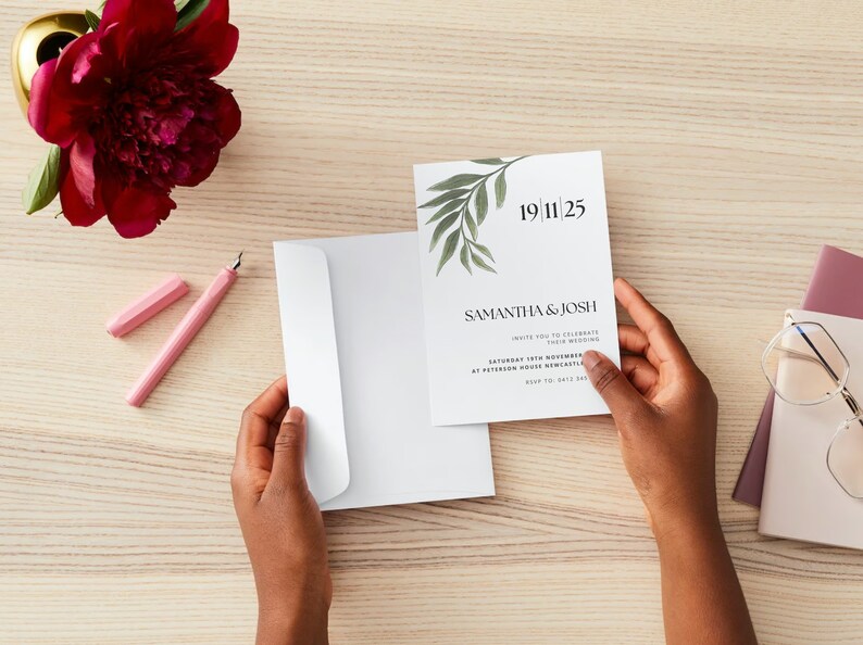 May include: A white wedding invitation with green foliage and the text "19 11 25", "Samantha & Josh", "Invite you to celebrate their wedding", "Saturday 19th November", "at Peterson House, Newcastle", "RSVP to: 0412 345 678".