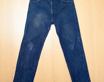 Vaqueros Levi's 505 vintage de los 80, talla 42x32 (equivalente a 39x32), lavado medio, estilo denim azul desgastado.