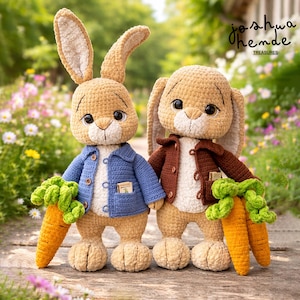 May include: Two crocheted bunny dolls, one in a blue jacket and the other in a brown jacket, each holding a carrot. The bunnies have tan fur, large ears, and button eyes. The image includes the text "joshua themde TREASURES".