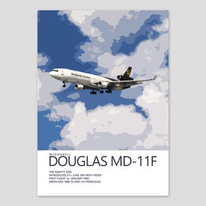 May include: A poster featuring a McDonnell Douglas MD-11F cargo plane in flight against a blue sky with white clouds. The plane is white with black and gold accents. Text at the bottom reads "DOUGLAS MD-11F" and details about the plane.