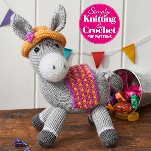 May include: A grey knitted donkey wearing a yellow and orange hat with a pink flower. The donkey is wearing a pink, orange and yellow striped scarf. The image is from Simply Knitting & Crochet PDF Patterns.