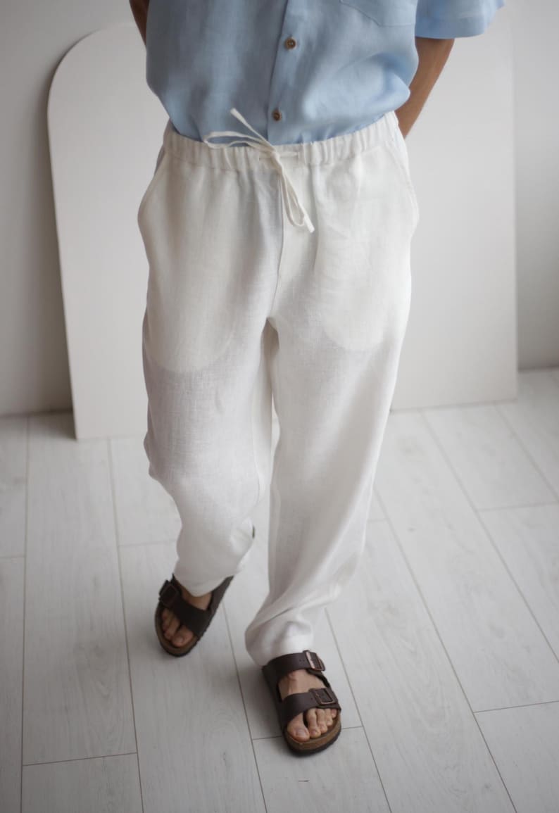 Close-up image of the linen pants, showing the breathable, soft texture and side pockets, ideal for easy, stylish wear in hot weather.