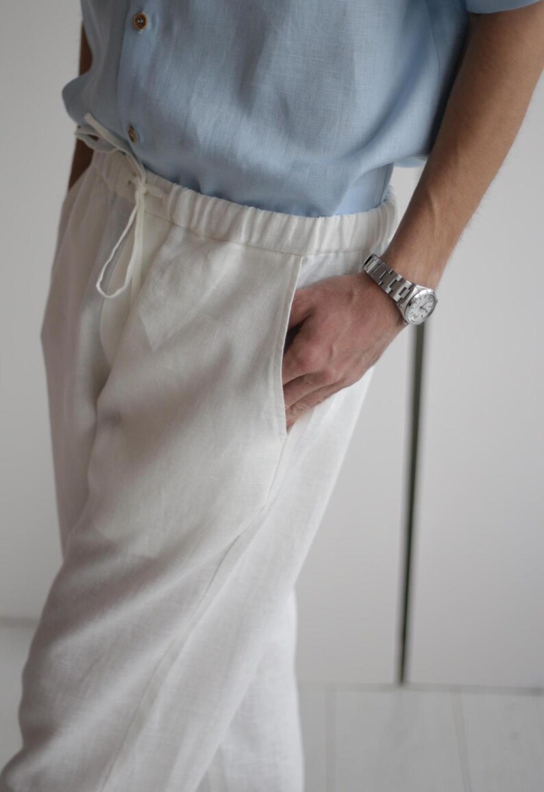 Close-up of men's white linen pants FLORIDA showing fine stitching and soft, high-quality linen fabric.