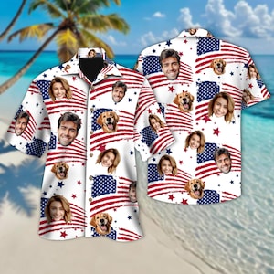 May include: White short-sleeved button-down shirt with a repeating pattern of the American flag, faces, and a golden retriever. The shirt features a classic collar and button closure. The design incorporates red stripes, blue stars, and various faces.