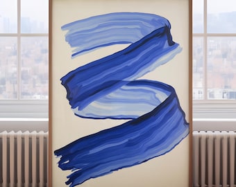 May include: A framed abstract art print featuring a flowing blue ribbon design against a cream background. The artwork is displayed on a wooden floor, with a window and radiator visible in the background.