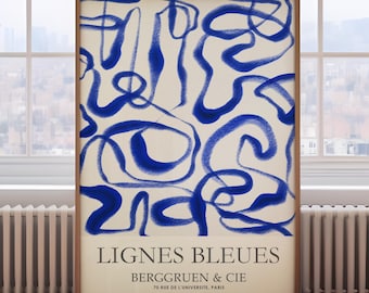 May include: A framed poster with a white background and blue abstract lines. The poster has the text "LIGNES BLEUES BERGGRUEEN & CIE 70 RUE DE L'UNIVERSITE, PARIS" at the bottom.