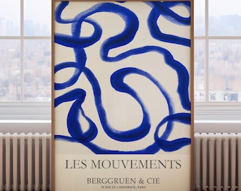 May include: A framed abstract art print with blue lines on a cream background. The print has the text "LES MOUVEMENTS BERGGRUEN & CIE 70 RUE DE L'UNIVERSITE, PARIS" at the bottom.