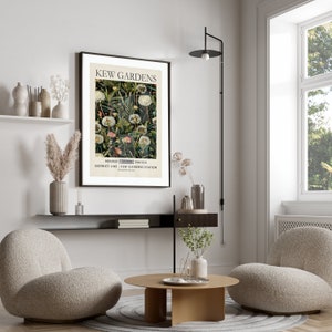 May include: A framed poster with a vintage design featuring a botanical illustration of dandelions. The poster has the text "Kew Gardens" and "Nearest Underground Station District Line - Kew Gardens Station" printed on it.