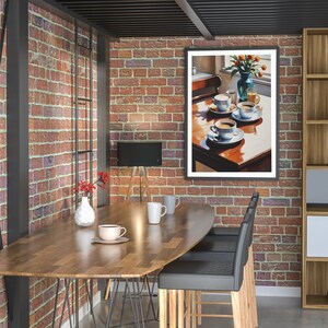 May include: A wooden table with a brown oval tabletop and black metal legs. There are four black chairs with wooden legs and a painting of a table setting with cups of coffee and a vase of flowers on the wall.