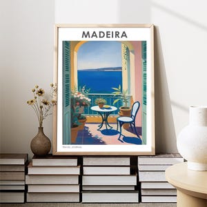 May include: A vintage travel poster with a painting of a balcony overlooking the ocean. The poster is titled "MADEIRA TRAVEL JOURNAL" and features a table and chair on the balcony.