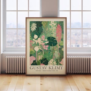 May include: A framed art print featuring a botanical illustration in shades of green, pink, and white. The artwork, attributed to Gustav Klimt, showcases various plant species. The print includes text at the bottom with the artist's name and location.