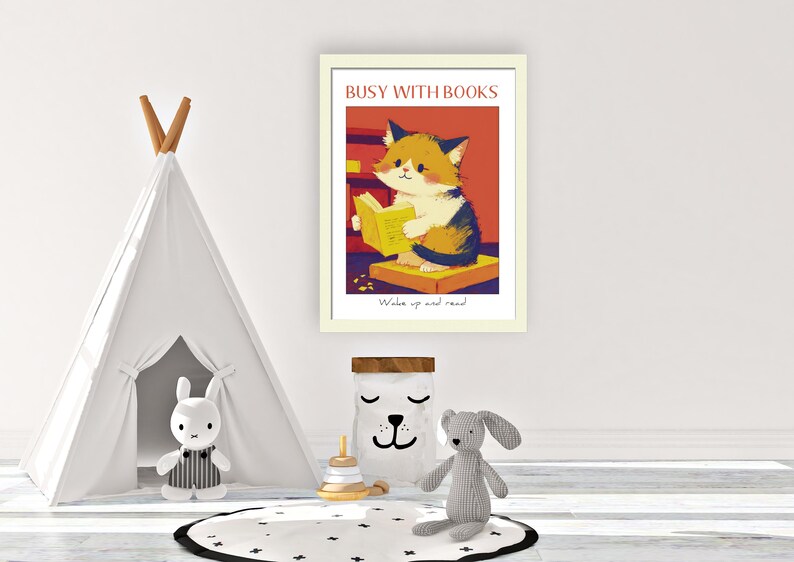 May include: A framed illustration of a cat reading a book. The illustration is in a cartoon style and features a cat with orange, white, and black fur. The cat is sitting on a yellow book and holding a book in its paws. The text on the frame reads "Busy with Books" and "Wake up and read".