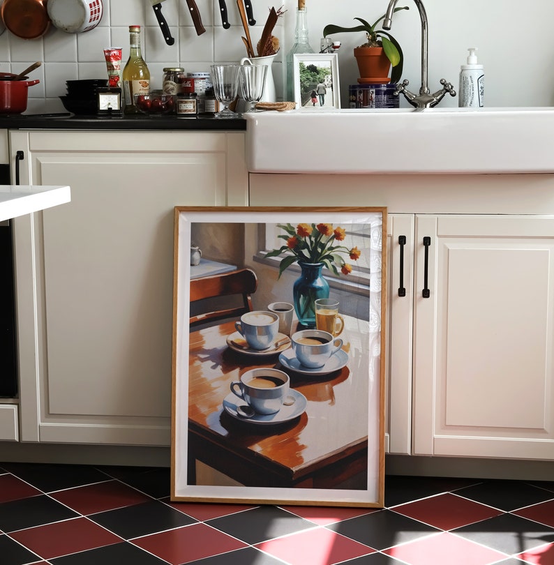 May include: A framed print of a still life painting featuring four cups of coffee on a wooden table. The cups are white with blue accents and are arranged in a row. There are flowers in a blue vase in the background.