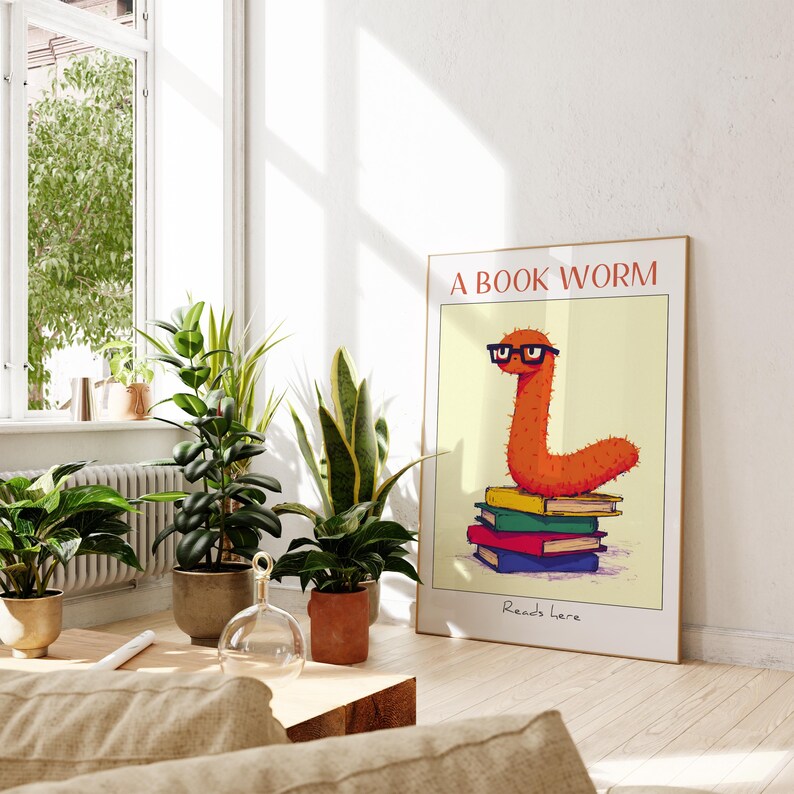 May include: A poster with a cartoon worm wearing glasses and sitting on a stack of books. The poster has the text "A Book Worm" and "Reads here" on it.
