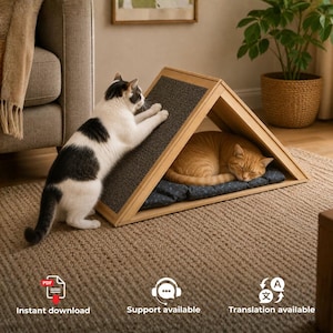 May include: A triangular wooden cat house with a dark grey textured scratching surface on one side. A black and white cat stands on its hind legs scratching the surface, while an orange tabby cat sleeps on a dark blue patterned cushion inside.