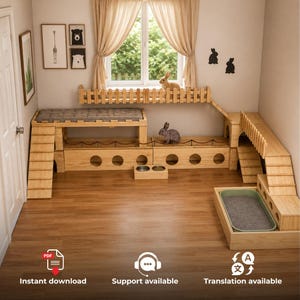 May include: A light-colored wooden rabbit playhouse structure featuring multiple levels, ramps, a fenced platform, circular cutouts, a gray cushioned top, a litter tray, and two metal food bowls, designed for indoor pet activity and rest.