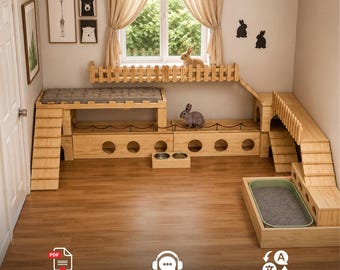 Puede incluir: Un recinto de madera para conejos de varios niveles que incluye rampas, plataformas, un balcón con valla, aberturas circulares, una superficie acolchada gris, una caja de arena y un cuenco doble. La estructura está diseñada para interiores.