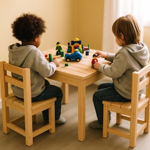 May include: A light-colored wooden table and two matching chairs. The table is surrounded by two children playing with colorful toy blocks and figures. A blue toy car is on the table.