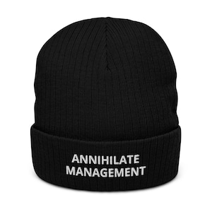 May include: Black knitted beanie with a white embroidered logo that says "ANNIHILATE MANAGEMENT".