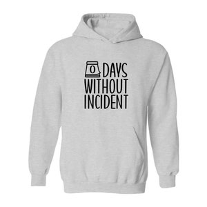 May include: A gray hooded sweatshirt with the text "0 DAYS WITHOUT INCIDENT" printed in black on the front.