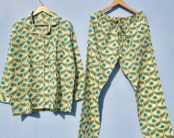 May include: A yellow and teal patterned pajama set with a long-sleeved shirt and pants.