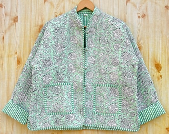 May include: A green and white floral patterned jacket with a mandarin collar and a button closure. The jacket has a striped trim and two pockets.