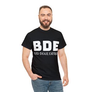 May include: A black t-shirt with white text that reads "BDE" and "BIG DEAK ENERGY".