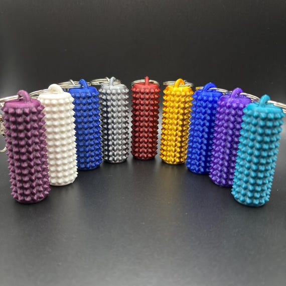 Set De 4 Llaveros Con Púas Sensoriales, 4 Colores Y Texturas Para Aliviar Estrés Y Concentración