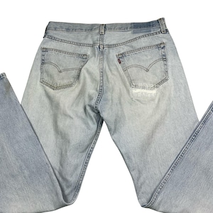 Vintage Levi’s 501 button fly lightwash straight leg 90s jeans. Made in the USA. Tagged as a 36x34, measures more as a 34 x 32.