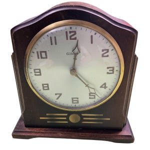 Vintage 1940 Gilbert Art Deco walnut wood mechanical wind up mantle clock. Made in the USA. Gorgeous clock! Needs to be repaired.