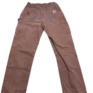 Vintage Carhartt double knee canvas workwear pants.  Made in the USA. Tagged as a 29x30 measures more as a 26 x 27