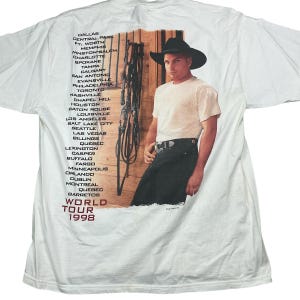 Vintage Garth Brooks 1998 Sevens tour Tshirt. High quality. tagged as an XL. 23 inches pit to pit, 28 inches long. Smoke and pet free home.