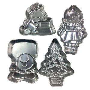 Vintage Wilton/Universal 1970s cake pan set of four .  Ziggy/Garfield/Raggedy Ann/Christmas. Late 70s and early 80s.