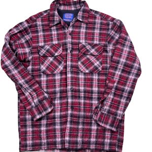 Vintage Pendleton 100% Virgin wool plaid button down flannel.  90s. Board shirt. Two front chest pockets. Button front enclosure.