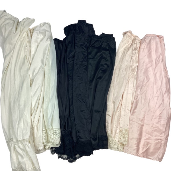 Vintage nylon/lace trim half slip bundle set of 7. Pale pink/creamy white/jet black. Elastic waist, various sizes. S/M/L.