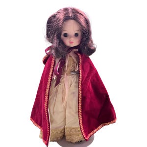 Vintage Madame Alexander Snow White 13 in doll with stand. Made in the USA. Rooted hair. No tears. Smoke and pet free home. USA made.