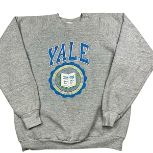 Vintage Yale Bulldogs 80/90s raglan sleeve crewneck sweatshirt. Made in the USA. Tagged as an XL, measures as a large.