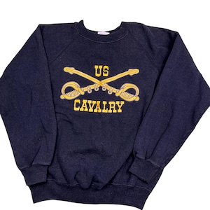 Vintage 80s US cavalry Raglan crewneck sweatshirt. Made in the USA. Tagged as an adult medium, measures as a S/XS. Black