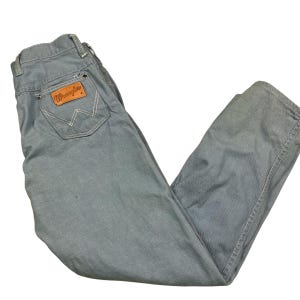 Vintage Wrangler 1960s/70s Sanforized lightweight denim jeans. Made in the USA.  Tagged as a 13/14, measures more as a 27 x 26.