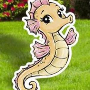 May include: A whimsical seahorse yard stake with a cartoon design. The seahorse is light tan with pink accents on its fins and crown. It is set against a backdrop of green grass and red flowers.