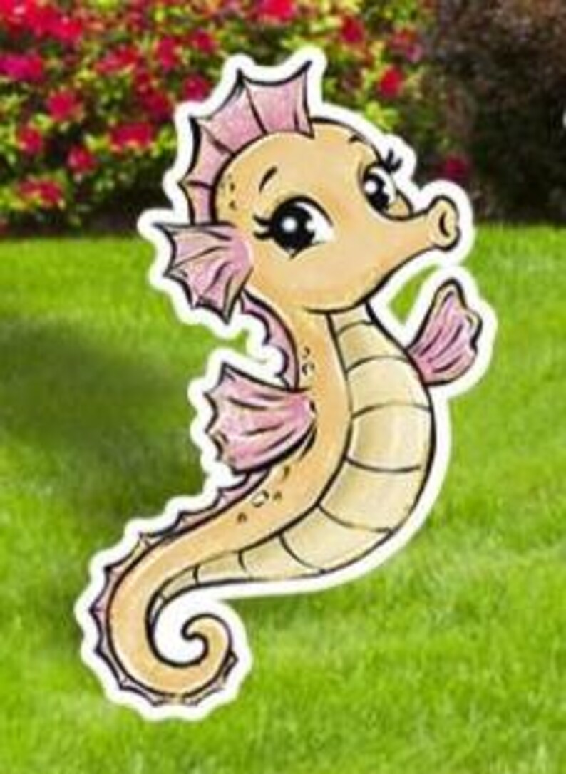 May include: A whimsical seahorse yard stake with a cartoon design. The seahorse is light tan with pink accents on its fins and crown. It is set against a backdrop of green grass and red flowers.