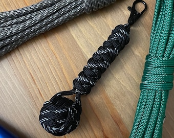 Monkey Fist Paracord Keychain with Snake Knot Handle and Clip | Black and white patterned keychain for keys, bags, luggage, or purse.