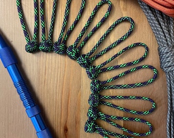 Paracord Zipper Pull Diamond Knot | Pack of Ten | Black, Green, and Purple patterned | handmade tab pull for bags, jackets, or luggage.