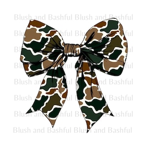 May include: A large camouflage bow with brown, green, and white colors. The bow is tied in a knot and the ends are flowing.