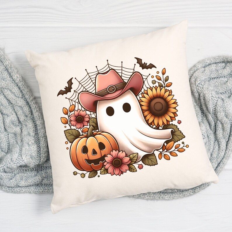 May include: A white ghost wearing a pink cowboy hat with a brown belt, surrounded by autumn foliage, a pumpkin, and sunflowers. The ghost has two black eyes and a friendly expression.