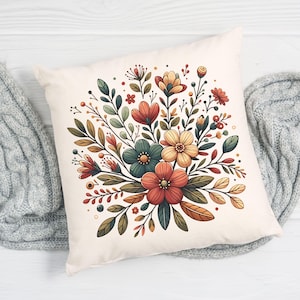 Peut inclure: Un oreiller blanc avec un motif floral. Les fleurs sont dans des tons de rouge, orange, jaune, vert et bleu. L'oreiller est parfait pour ajouter une touche de couleur et de style &agrave; n'importe quelle pi&egrave;ce.