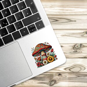 May include: A colorful psychedelic mushroom with red, blue, and green swirls, surrounded by yellow, red, and orange flowers. The mushroom is on a white background.